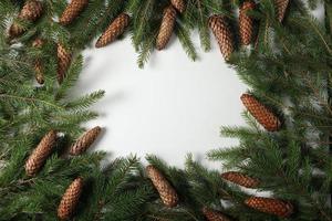 Holidays greeting card or banner composition with pine tree branches. Merry Christmas background and Happy New Year 2023. photo