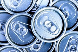 Close up aluminum can lids used for containing beverages photo