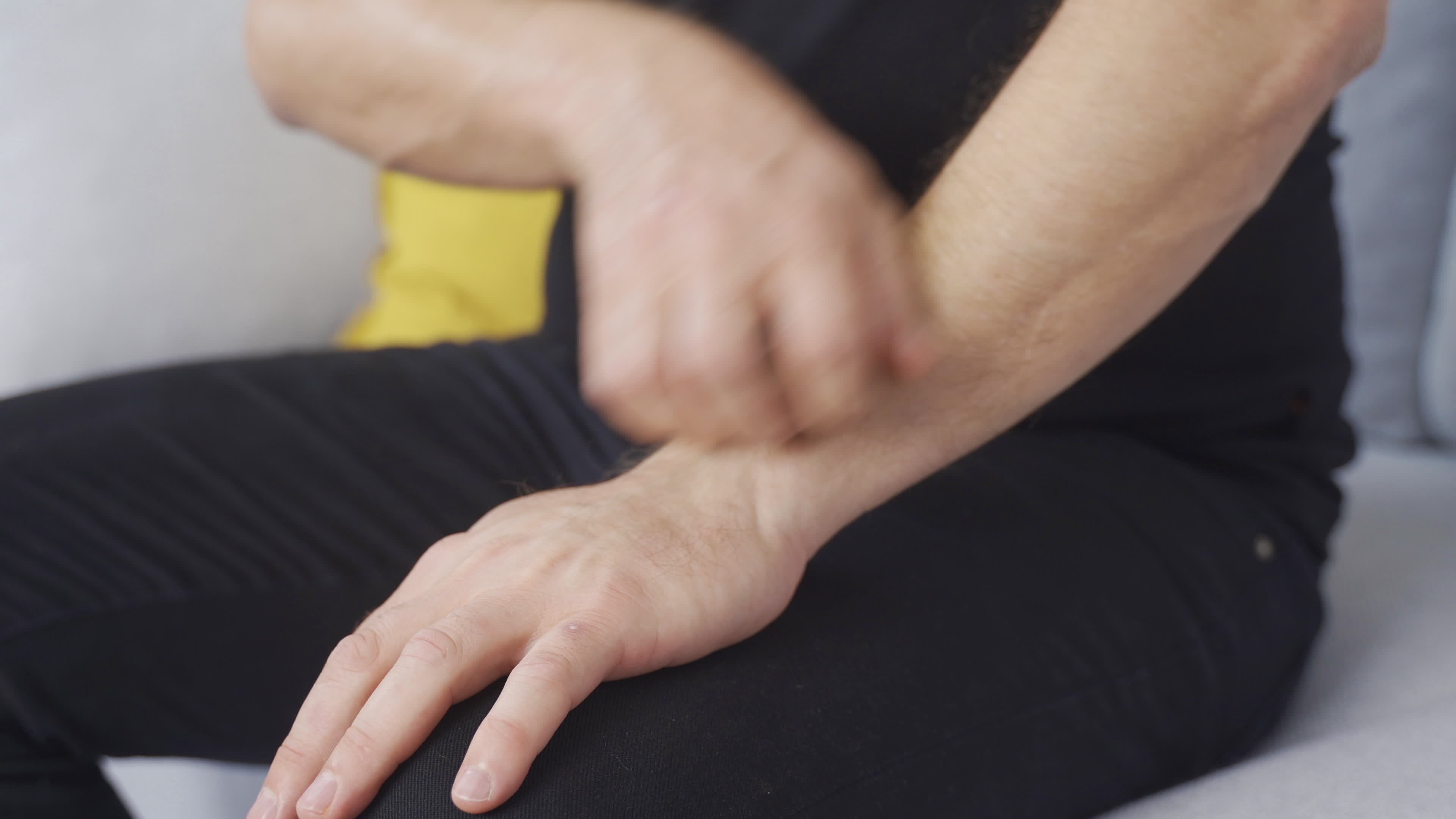 Allergy man scratching his hands. Irritated hands. The man quickly