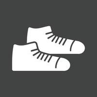 zapatillas glifo icono invertido vector