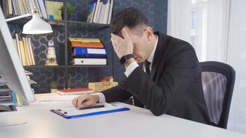 Worried businessman signing paperwork. The worried businessman who does not want to sign is under pressure. video