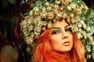 close up portrait of cute young girl with hop on head and nice makeup photo