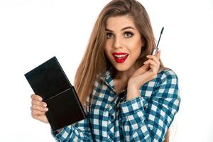 picture of a girl with a make-up brush for lash in hands photo