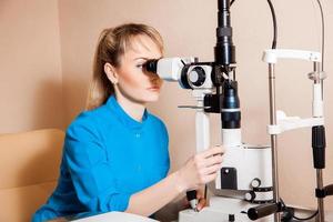 Doctor at work machine for checking vision photo