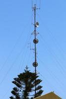 High antenna for emitting and receiving radio waves. photo