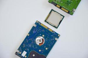 Looking from above, the chip, CPU and hard drive are placed in a mess. on a white background photo