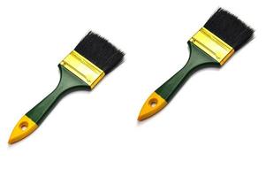 2 paint brushes placed on a white background photo