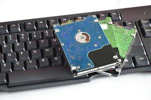 2.5 inch hard drive, rotating plate, placed on the keyboard photo