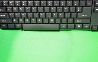 front view of keyboard keys placed on a green background photo