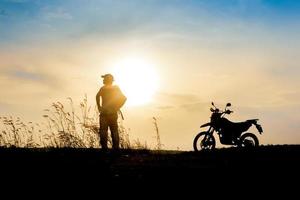 man with motocross beautiful light mountain independent adventure tourism concept photo
