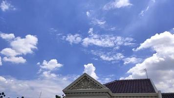 Cloud time lapse film of a house under the bright blue sky video