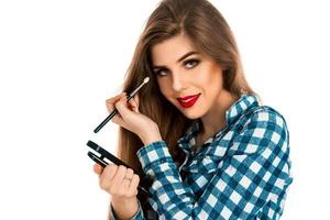 Isolated on white background makeup artist with brushes photo