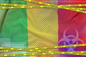 Mali flag and Covid-19 quarantine yellow tape. Coronavirus or 2019-nCov virus concept photo