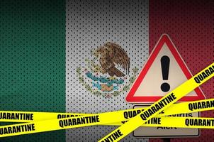 Mexico flag and Covid-19 quarantine yellow tape. Coronavirus or 2019-nCov virus photo