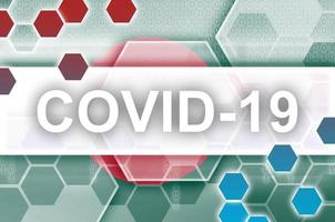 Bangladesh flag and futuristic digital abstract composition with Covid-19 inscription. Coronavirus outbreak concept photo