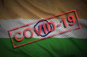 India flag and red Covid-19 stamp. Coronavirus 2019-nCov outbreak photo