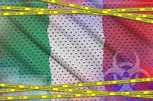 Italy flag and Covid-19 quarantine yellow tape. Coronavirus or 2019-nCov virus concept photo
