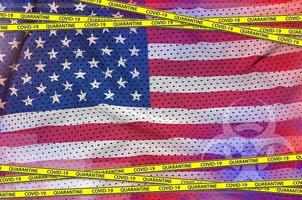 United States of America flag and Covid-19 quarantine yellow tape. Coronavirus or 2019-nCov virus concept photo