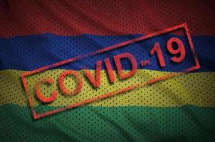 Mauritius flag and red Covid-19 stamp. Coronavirus 2019-nCov outbreak photo