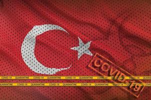 Turkey flag and orange Covid-19 stamp with border tape. Coronavirus or 2019-nCov virus concept photo