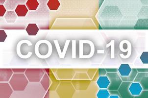 Guinea flag and futuristic digital abstract composition with Covid-19 inscription. Coronavirus outbreak concept photo