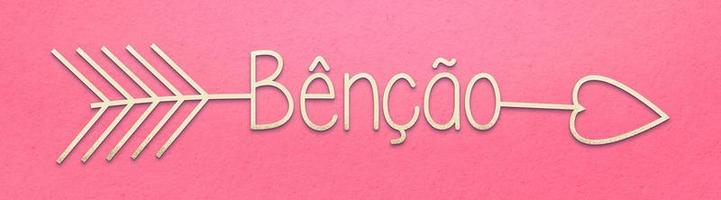 Beige arrow with the word blessing in Brazilian Portuguese on pink background. Translation - Blessing. photo