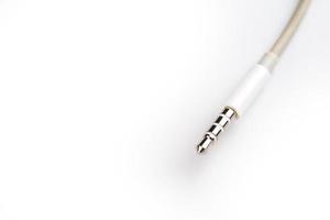 Isolated white aux cable on white background photo