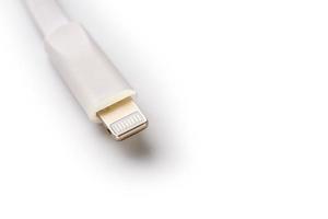 Connector lightning on a white background. This is a proprietary connector used to connect mobile devices to well-known host computers photo