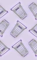 Pattern of many small shopping carts on a violet background. Minimalism flat lay top view photo