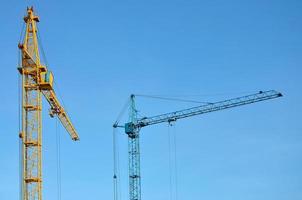 Tower crane against a blue sky photo