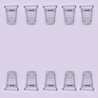 Pattern of many small shopping carts on a violet background. Minimalism flat lay top view photo