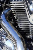 Fragment of chromed shiny body part of old classic motorbike photo