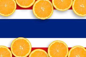 Thailand flag  in citrus fruit slices horizontal frame photo