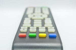 The bottom view of the remote control has four colored buttons. photo