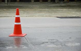 orange traffic cone set on the road photo