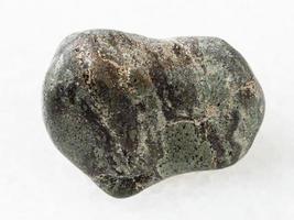 polished Suevite stone on white photo