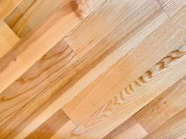 la textura del parquet de madera en el piso está hecha de componentes rectangulares. foto