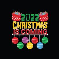 2022 Christmas is coming vector t-shirt template. Christmas t-shirt design. Can be used for Print mugs, sticker designs, greeting cards, posters, bags, and t-shirts.