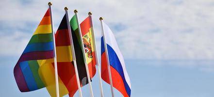 Rainbow flag and National flags of European countries, soft and selective focus, concept for LGBT celebration and respecting gender diversity of human in European countries around the world. photo