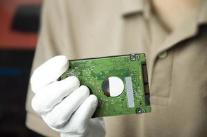 Hard disks are still popular in use today, holding a hard disk in your hand. photo