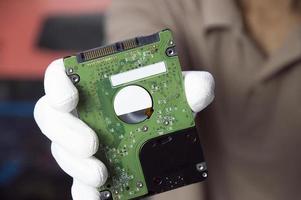 Hard disks are still popular in use today, holding a hard disk in your hand. photo