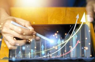 concept, business man Using a tablet In business analysis, business success photo