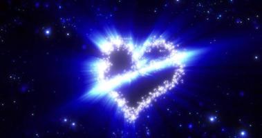 A heart from a flying comet salute and the inscription love from particles and lines of luminous shiny gold on a blue background for Valentine's Day. Abstract screensaver, video in high quality 4k