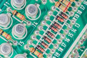 Condensers and Resistor assembly on the circuit board photo