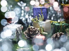 Christmas tree and gift box balls. Bokeh garlands in the blur background . cube block to contain the purpose of doing business overcoming. Developing ideas for the new year 2023 photo