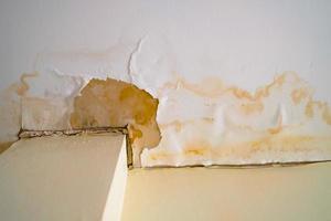 Water damaged ceiling roof, brown stain, office building photo