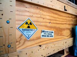 Radiation label beside the transport wooden box Type A package photo