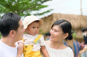 A little boy beloved by his father and mother. photo