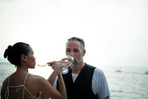 Happy moments of interracial couples on a yacht The couple had their honeymoon at one of Asia's photo