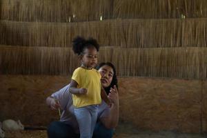 Asian-African American family rest on vacation by bringing children to the zoo photo